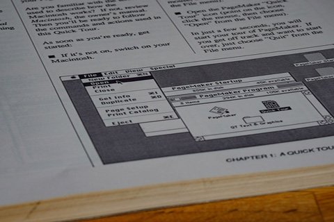 Decorative photo of a page in a computer's technical manual.